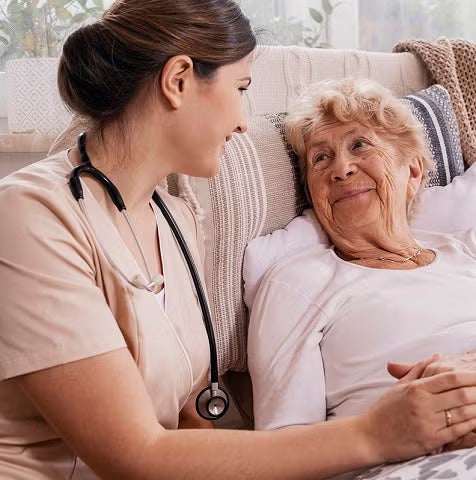 Hospice caregiver with patient