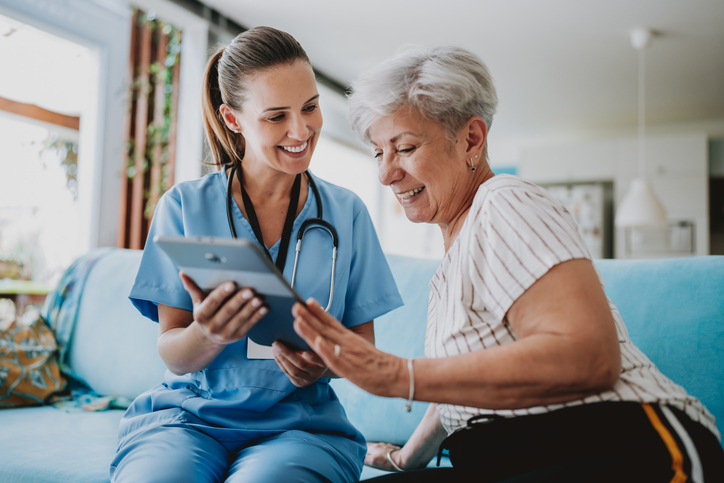 Caregiver helping patient with virtual care